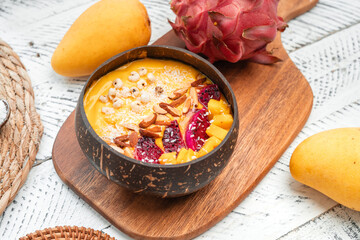 Mango Fruit Smoothie Bowl in Coconut Shell Cup