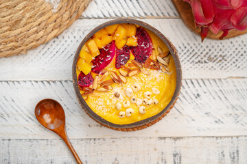 Mango Fruit Smoothie Bowl in Coconut Shell Cup