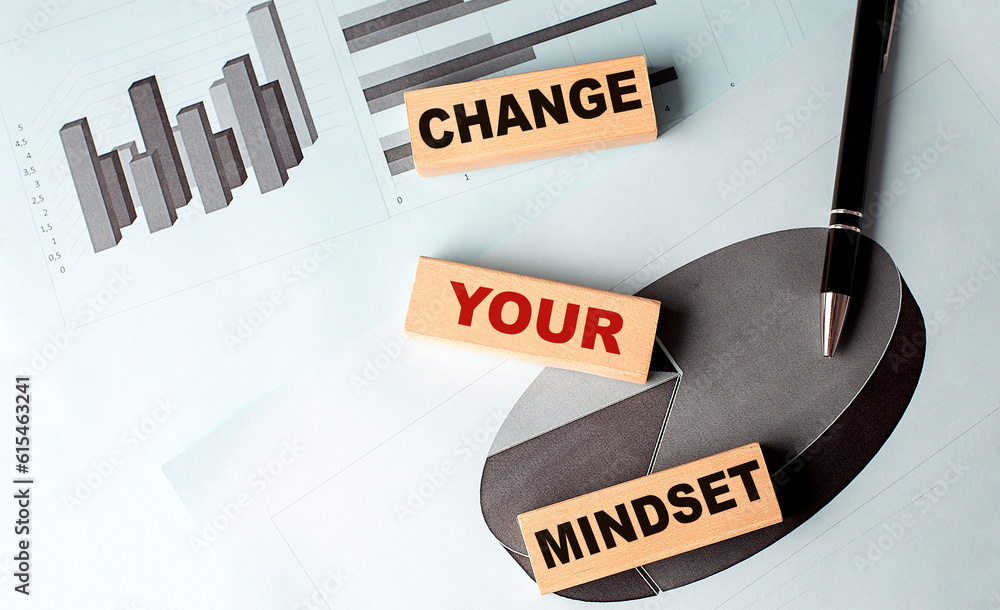 Poster change your mindset text on wooden block on chart background