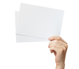 Hand holding two blank sheets of paper (tickets, flyers, invitations, coupons, banknotes, etc.), cut out
