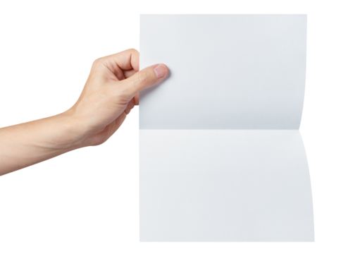 Hand holding a sheet of white paper, folded in half, cut out