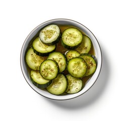 Bowl of Sliced Dill Pickles Isolated on a White Background 