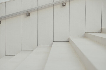 Side view of beige concrete stairs and wall minimal style with copy space. Success concept.