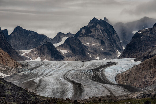 View of glacier flowing through the mountain peaks in Prins Christian Sund at the Southern tip of Greenland; Southern Greenland, Greenland