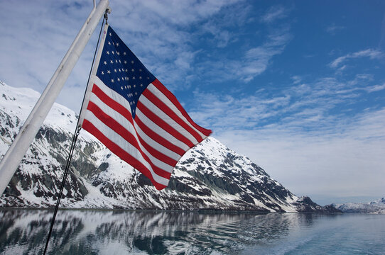 American flag in the stern of a boat in Glacier Bay National Park and Preserve, Alaska, USA; Alaska, United States of America