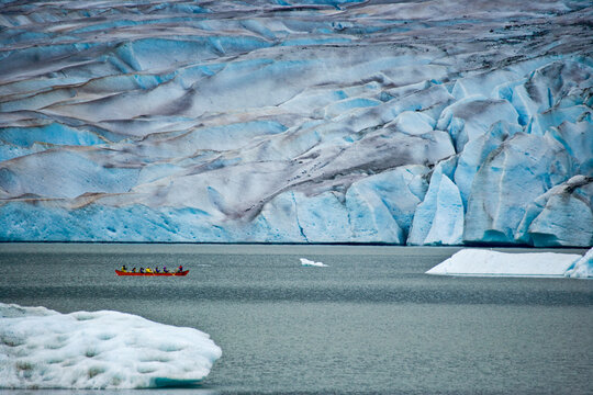 Boat rows along the Mendenhall Glacier; Juneau, Alaska, United States of America