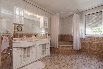 Bathroom with pink marble sink on white wooden cabinets