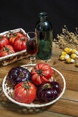 A still life of delicious ripe tomatoes inside baskets