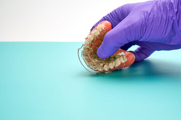 Dental technician with a orthodontic appliance