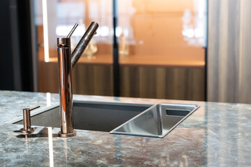 A modern faucet and sink in a trendy kitchen