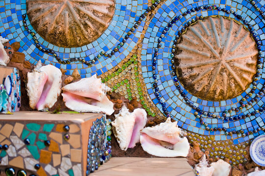 Conch shells decorate steps covered in a colourful mosaic; Utilla, Honduras