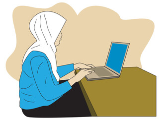 A muslim woman  in front of her laptop in her working desk