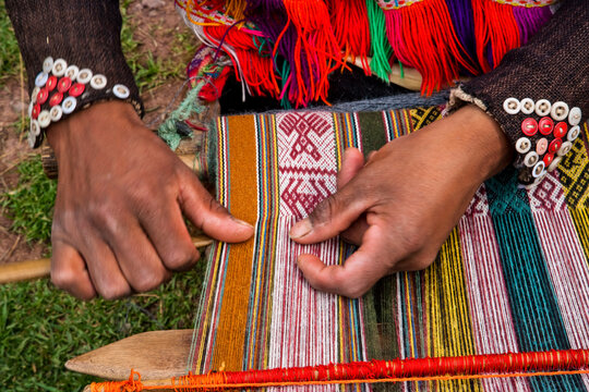 Peruvian weaving using traditional methods; Sacred Valley, Peru