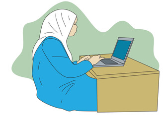 A muslim woman  in front of her laptop in her working desk