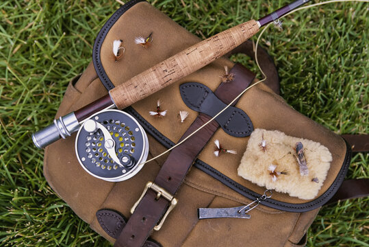 Fly fishing tackle lies on the grass; Wyoming, United States of America