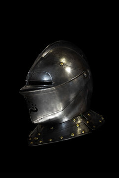 Medieval helmet on a black background, Muiden Castle; Muiden, Netherlands