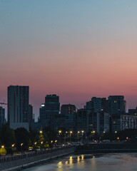 Fototapeta na wymiar Вeautiful sunset near the river, turning into the night, view of the city of Dnipro
