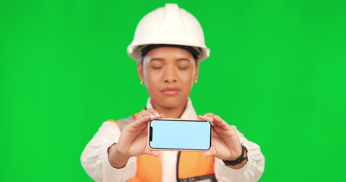 Green screen, phone and portrait of construction worker, engineer or industrial mockup on studio background. Chroma key, technology and mobile app for information, architect or industry marketing