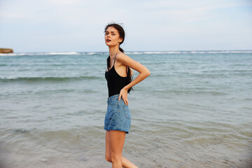 Fototapeta na wymiar beach woman ocean summer walking vacation sunset sea lifestyle smile sand