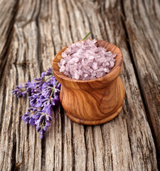 Obraz na płótnie Canvas Lavender flowers on wooden background with lavander salt