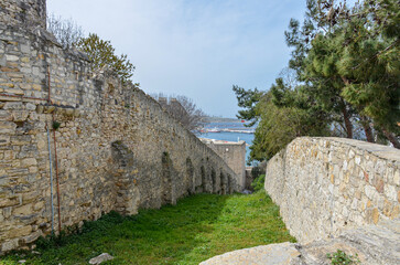 Fototapeta na wymiar walls and ditch of Cesme castle (Izmir province, Turkey)