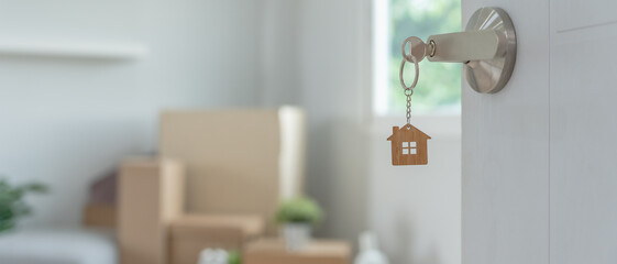 Moving house, relocation. The key was inserted into the door of the new house, inside the room was...