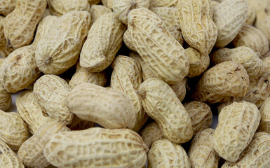 Bunch peanuts on a white background close-up. Macro photography of peanuts.