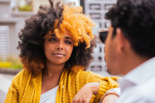 Smiling woman speak to friend on street