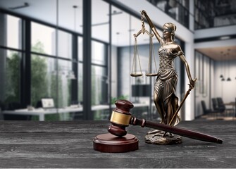 Legal concept. Statue of Justice and wooden gavel on table.