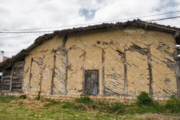 Old weathered wooden rural farm barn closeup