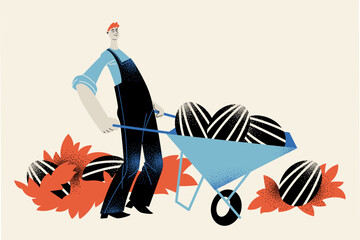 A man in overalls with a wheelbarrow full of watermelons. Harvest time.