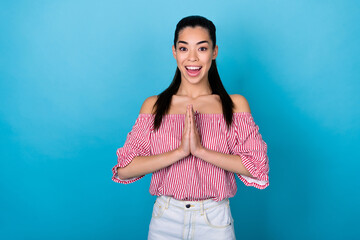 Fototapeta na wymiar Photo of shiny excited girl dressed off shoulders blouse arms together asking buy new clothes empty space isolated blue color background
