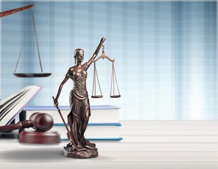Legal concept. Statue of Justice and wooden gavel on table.