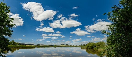 panorama view on a lake with sky reflection