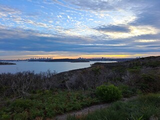 Sydney downtown visible on the horizon from the Burragula Lookout in Manly, Sydney, Australia