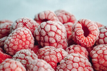 a close up of  frozen raspberries