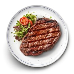 Top view of grilled steak with vegetables on a white plate