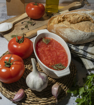 Fresh ingredients for tomato sauce preparation on table