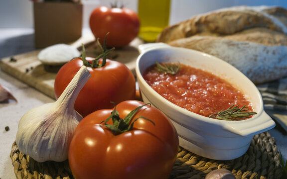 Fresh ingredients for tomato sauce preparation on table