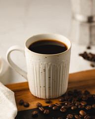 cup of coffee with beans