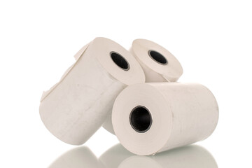 Three rolls of paper cash register tape, close-up isolated on white background.