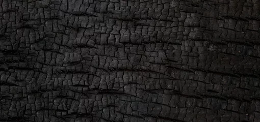 Foto op Plexiglas Burn wood texture. Black background, Details on the surface of charcoal, burnt wood texture, Grunge, burning fire, Dark material. © Teerapat