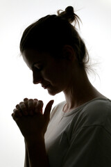 Closeup Profile Of A Woman Praying In Silhouette Isolated - 615515441