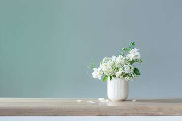 white summer flowers on green background