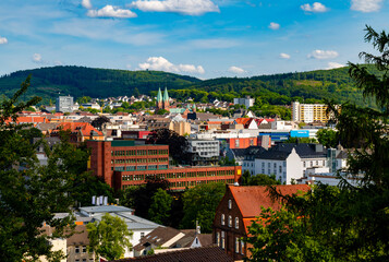 Panoramic view of Iserlohn town centre in rural Sauerland with hills and forests in the background....
