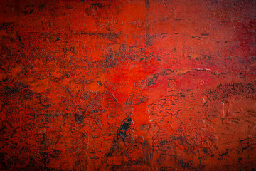 Old red metal sheet with rust and oil in the garage can be use as background 