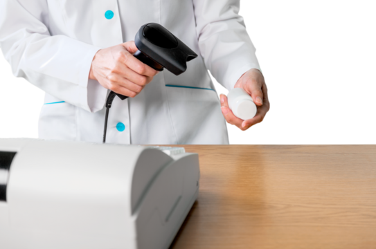 Close-up of Pharmacist Scanning a Pill Bottle