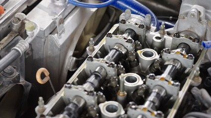 Auto mechanic repair engine in a car repair shop.Car engine repair. Car service