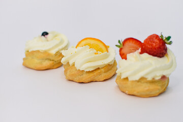 background of colorful cakes with fruit- close up of cakes