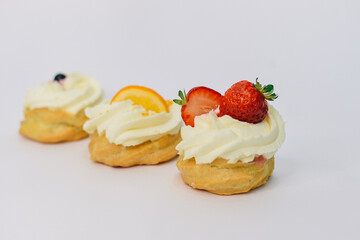 background of colorful cakes with fruit- close up of cakes